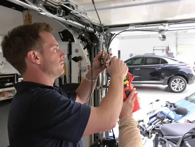 Fairhaven Garage Door Repair safety certified technician performing cable replacement in Fairhaven